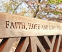 Message engraved on the top rail of a teak bench